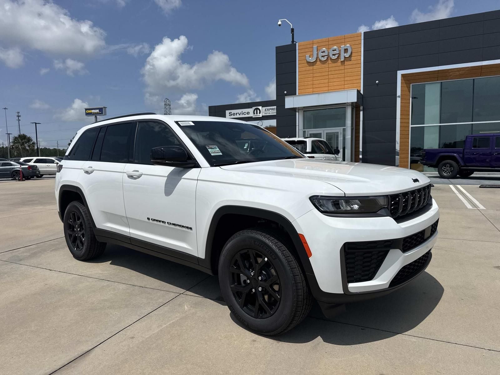 2026 Jeep Grand Cherokee GRAND CHEROKEE LAREDO ALTITUDE 4X2 in Bright White Clear-Coat Exterior Paint — front three-quarter view