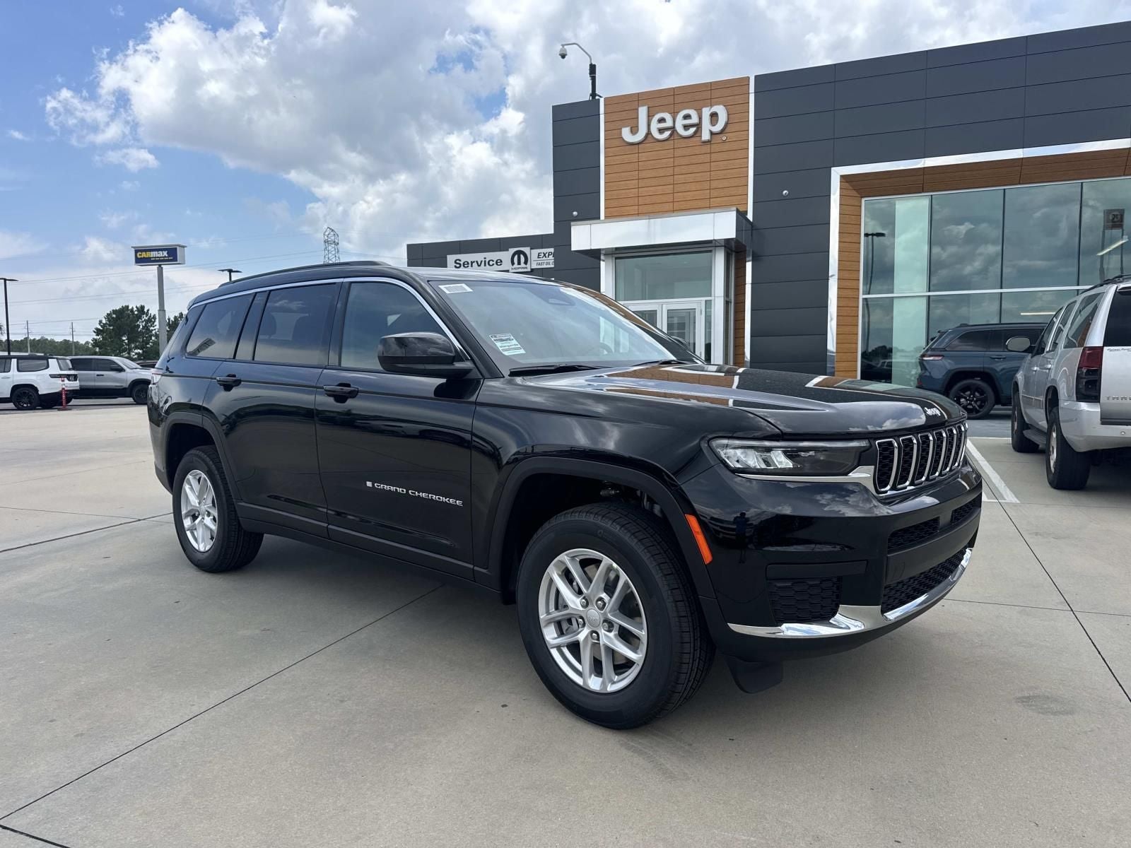 2026 Jeep Grand Cherokee GRAND CHEROKEE L LAREDO 4X2 in Diamond Black Crystal Pearl-Coat Exterior Paint — front three-quarter view