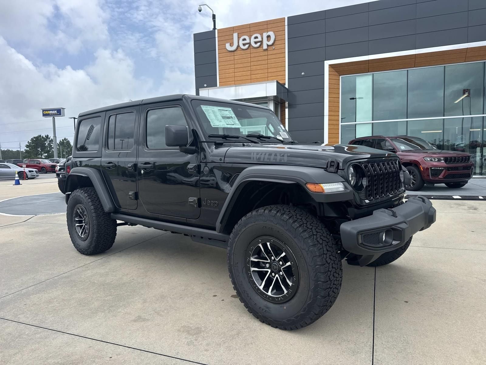 2026 Jeep Wrangler WRANGLER 4-DOOR WILLYS in Black Clear-Coat Exterior Paint — front three-quarter view