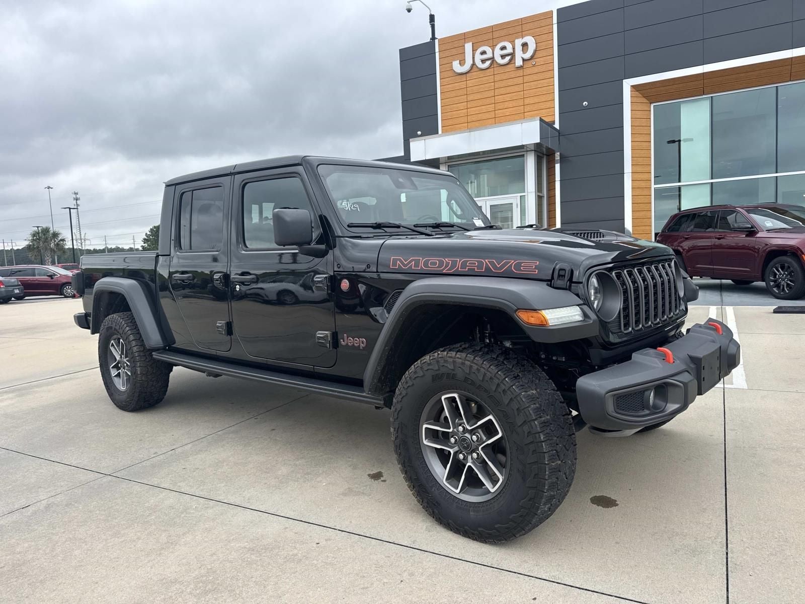 2024 Jeep Gladiator Mojave in Black Clearcoat — front three-quarter view
