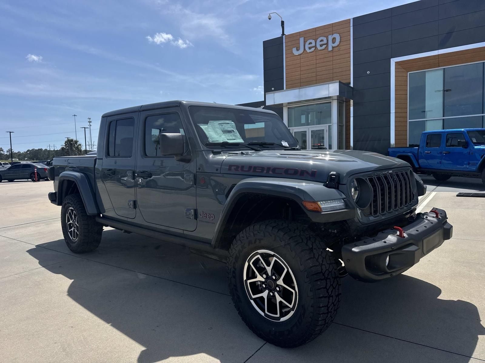 2026 Jeep Gladiator GLADIATOR RUBICON X 4X4 in Anvil Clear-Coat Exterior Paint — front three-quarter view