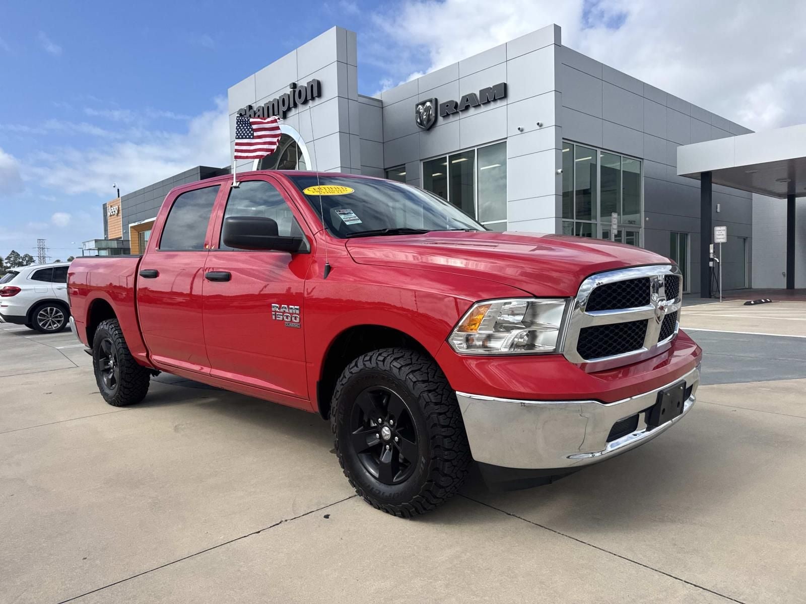 2022 RAM 1500 Classic SLT Crew Cab 4x4 5'7' Box in Flame Red Clearcoat — front three-quarter view