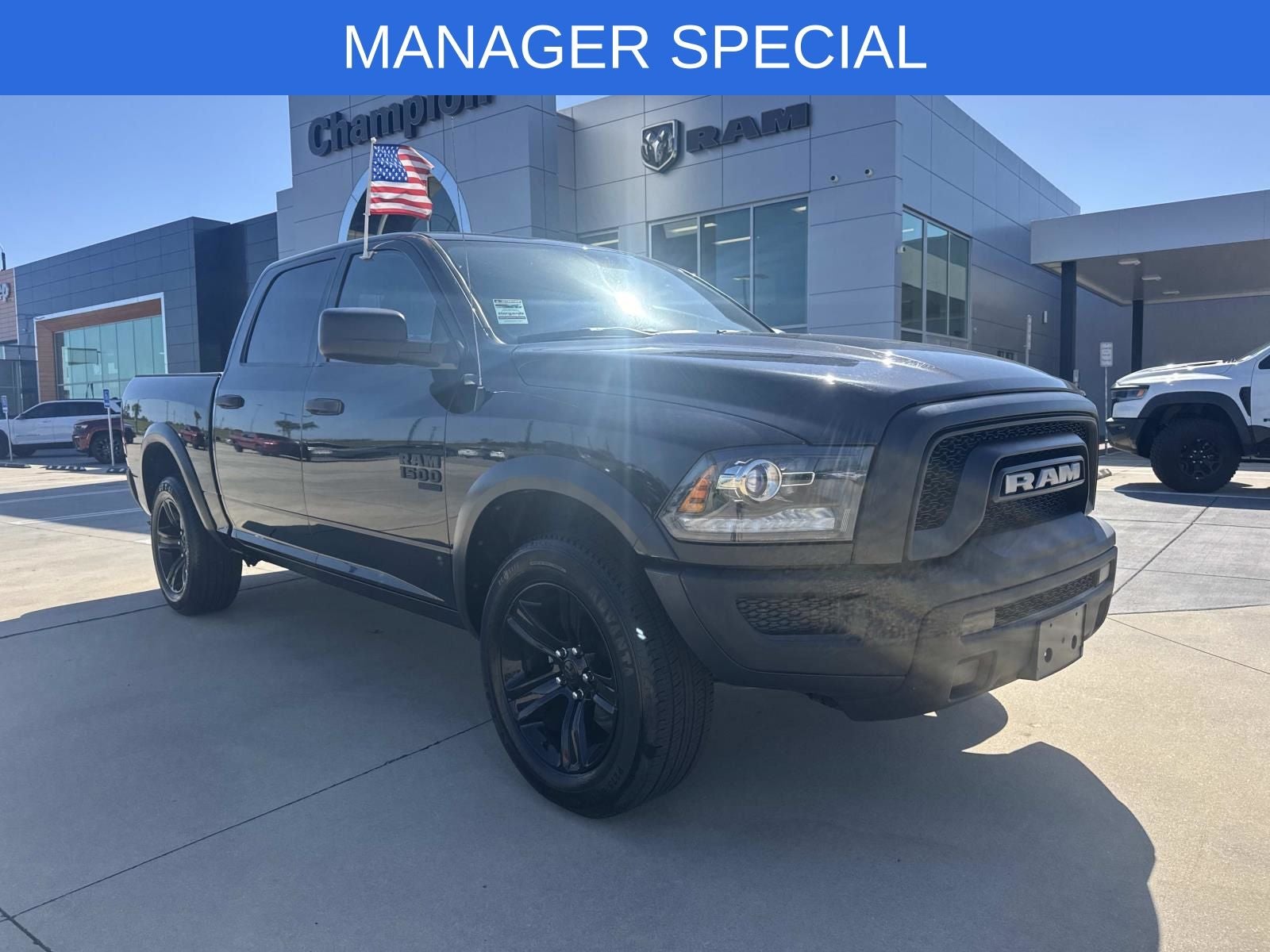 2024 RAM 1500 Classic Warlock Crew Cab 4x4 5'7' Box in Diamond Black Crystal Pearlcoat — front three-quarter view
