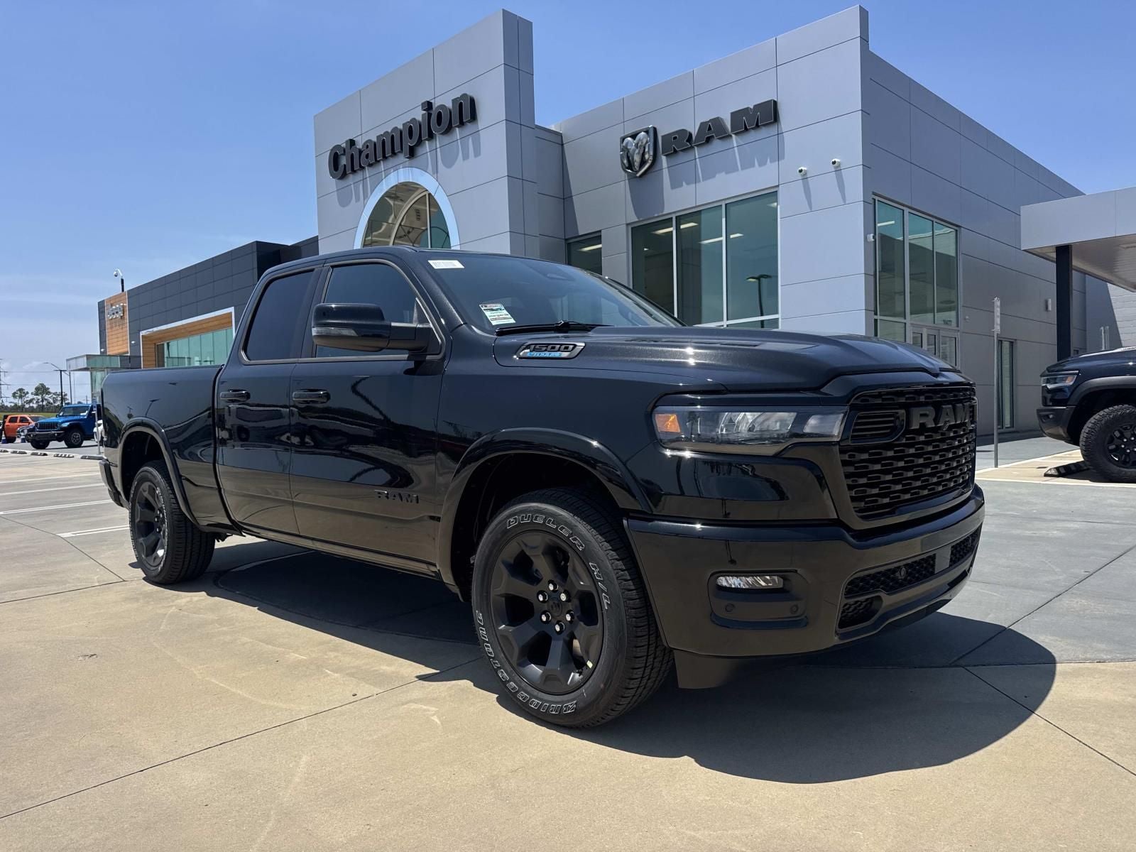 2026 RAM Ram 1500 RAM 1500 BIG HORN QUAD CAB 4X2 6'4' BOX in Diamond Black Crystal Pearl-Coat Exterior Paint — front three-quarter view