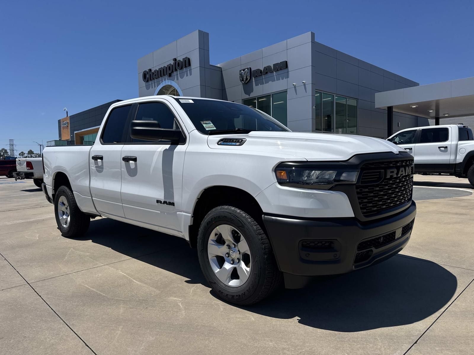 2026 RAM Ram 1500 RAM 1500 TRADESMAN QUAD CAB 4X4 6'4' BOX in Bright White Clear-Coat Exterior Paint — front three-quarter view