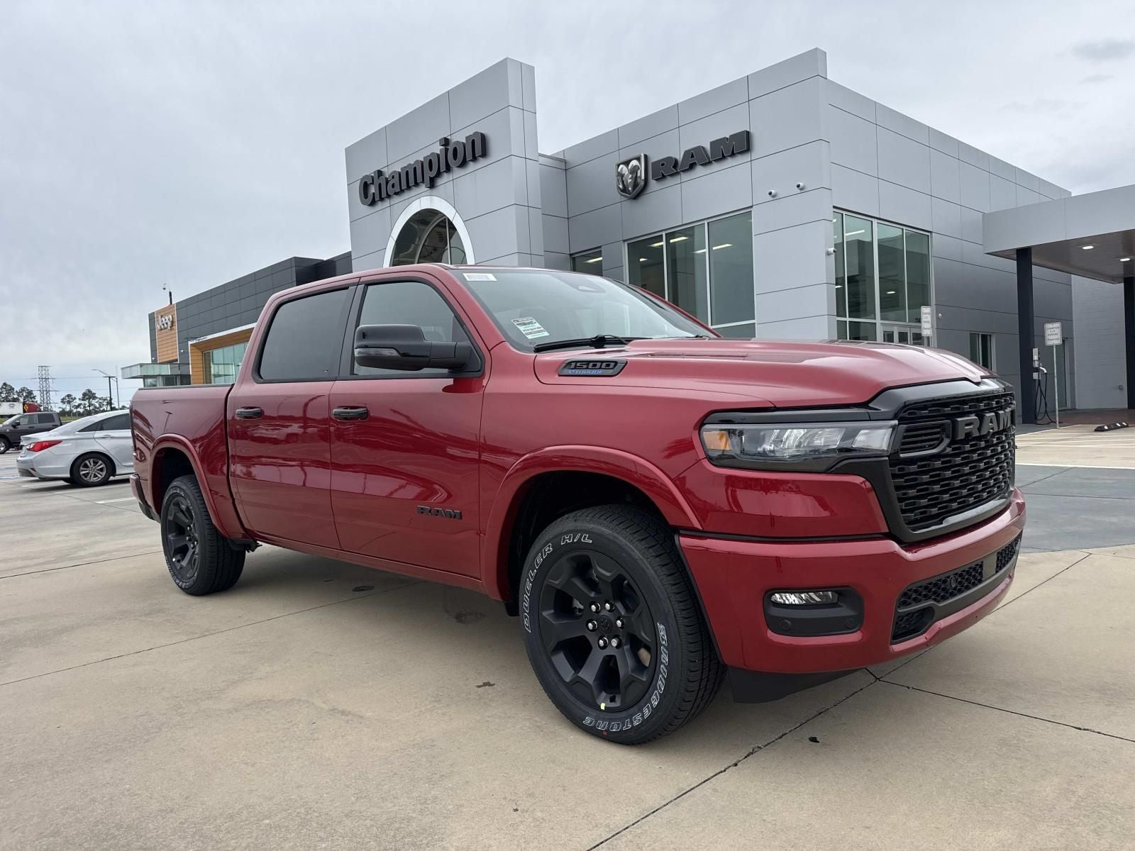 2026 RAM Ram 1500 RAM 1500 BIG HORN CREW CAB 4X4 5'7' BOX in Molten Red Pearl-Coat Exterior Paint — front three-quarter view