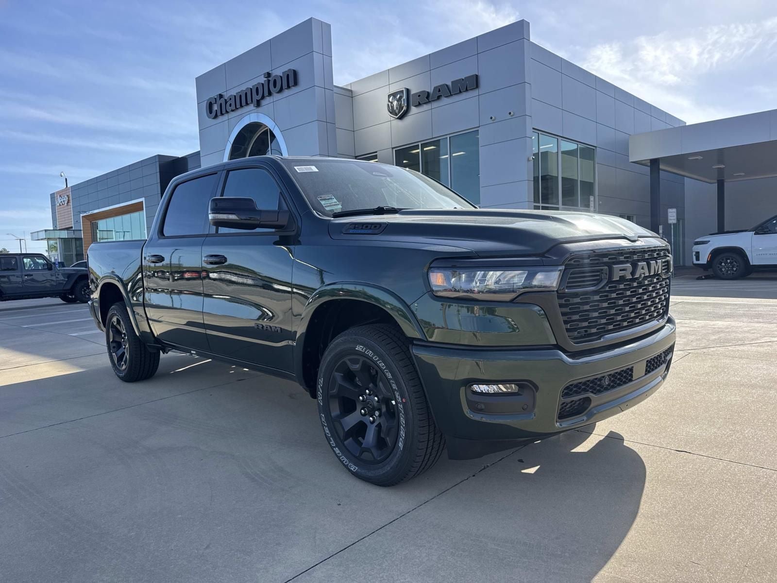 2026 RAM Ram 1500 RAM 1500 BIG HORN CREW CAB 4X4 5'7' BOX in Serrano-Green Metallic Exterior Paint — front three-quarter view
