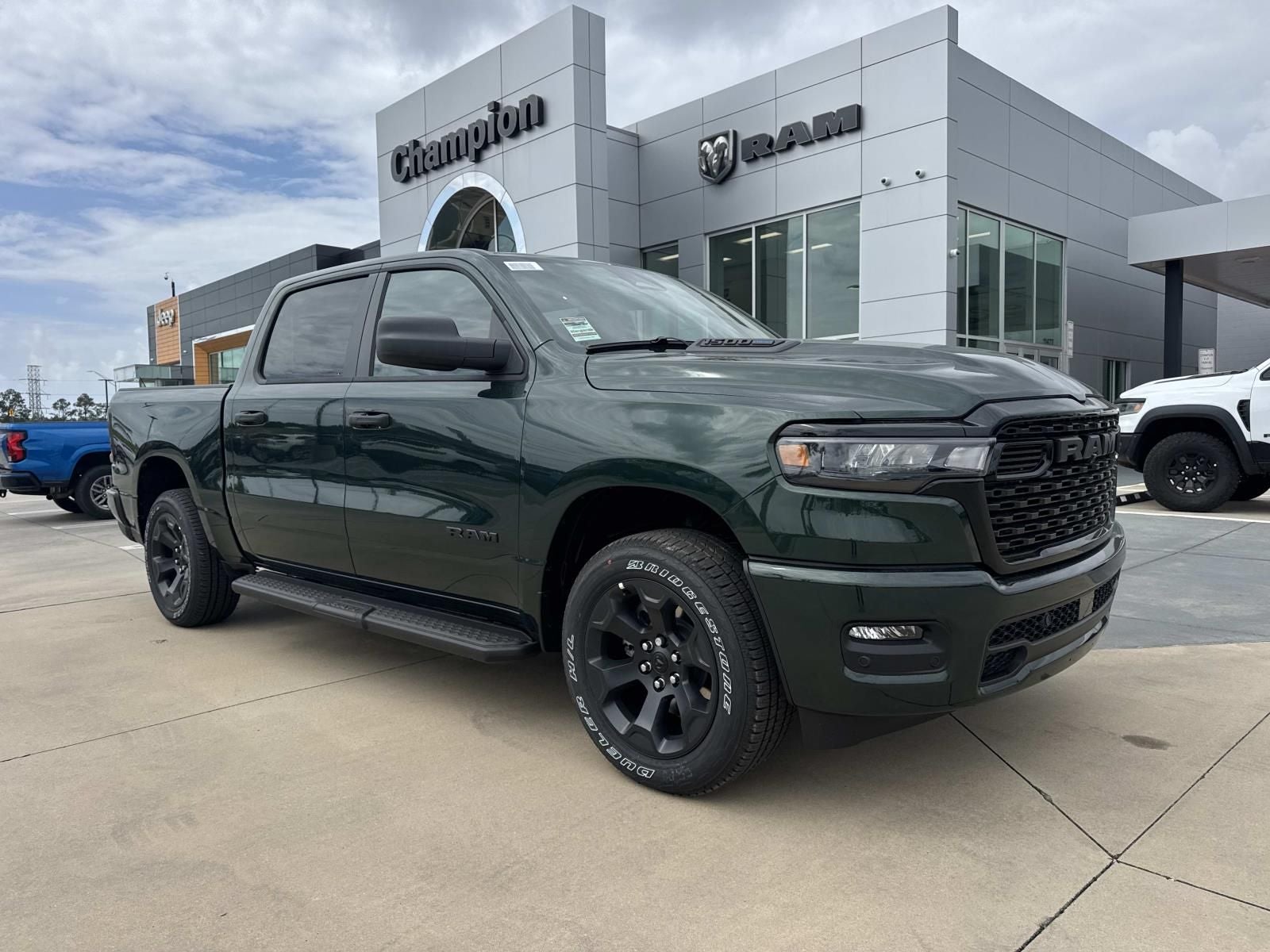 2026 RAM Ram 1500 RAM 1500 EXPRESS CREW CAB 4X4 5'7' BOX in Serrano-Green Metallic Exterior Paint — front three-quarter view