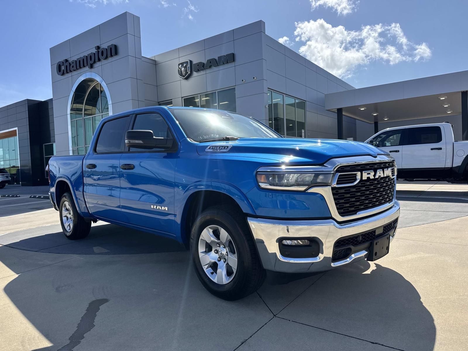 2025 RAM 1500 Big Horn Crew Cab 4x4 5'7' Box in Hydro Blue Pearlcoat — front three-quarter view
