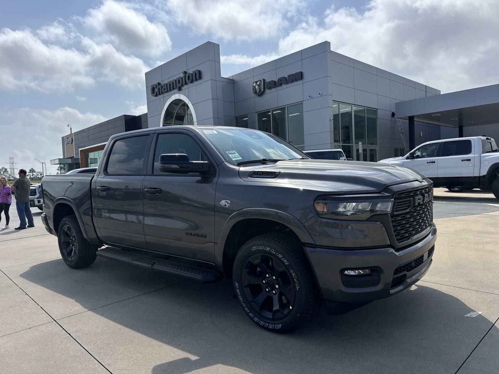 2026 RAM Ram 1500 RAM 1500 BIG HORN CREW CAB 4X4 5'7' BOX in Granite Crystal Metallic Clear-Coat Exterior Paint — front three-quarter view
