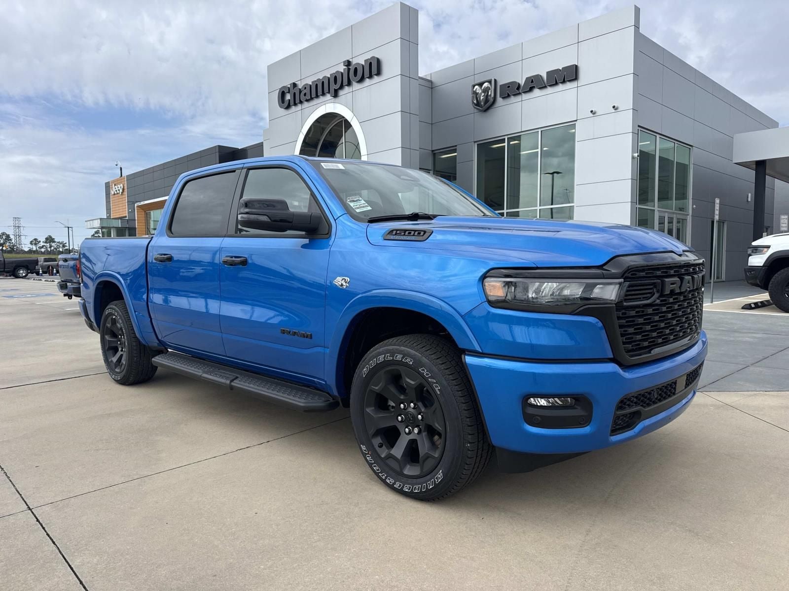 2026 RAM Ram 1500 RAM 1500 BIG HORN CREW CAB 4X4 5'7' BOX in Hydro Blue Pearl-Coat Exterior Paint — front three-quarter view