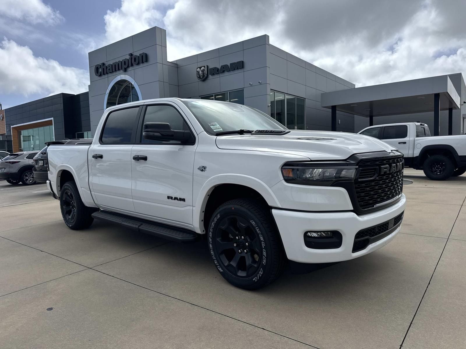 2026 RAM Ram 1500 RAM 1500 BIG HORN CREW CAB 4X4 5'7' BOX in Bright White Clear-Coat Exterior Paint — front three-quarter view