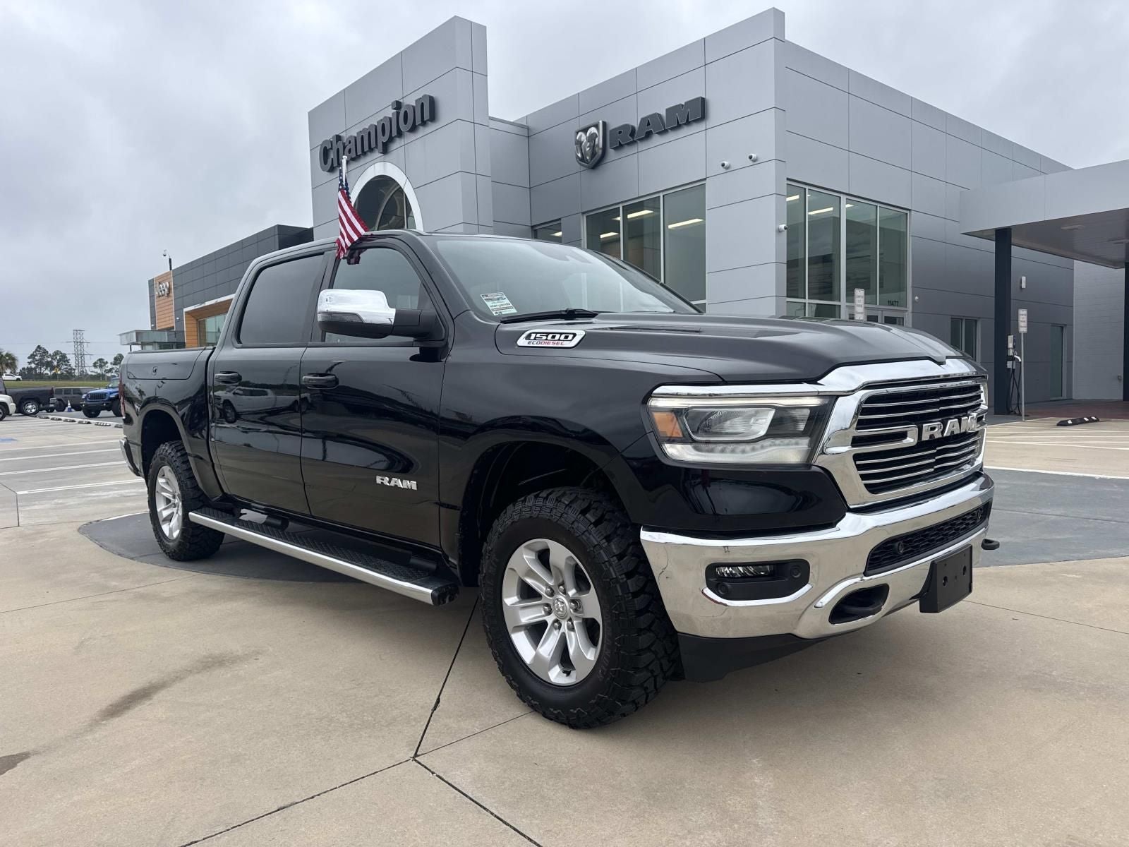2023 RAM 1500 Laramie Crew Cab 4x4 5'7' Box in Diamond Black Crystal Pearlcoat — front three-quarter view