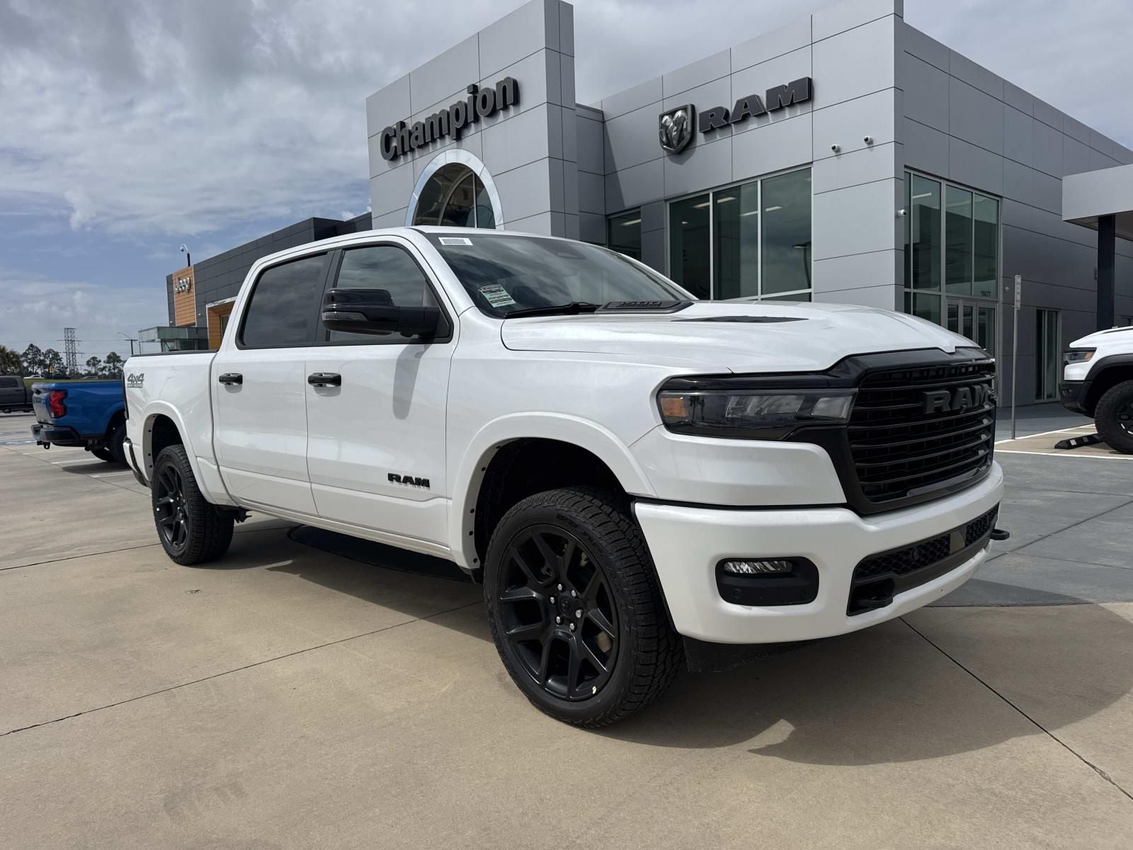 2026 RAM Ram 1500 RAM 1500 LARAMIE CREW CAB 4X4 5'7' BOX in Ivory White Tri-Coat Pearl-Coat Exterior Paint — front three-quarter view