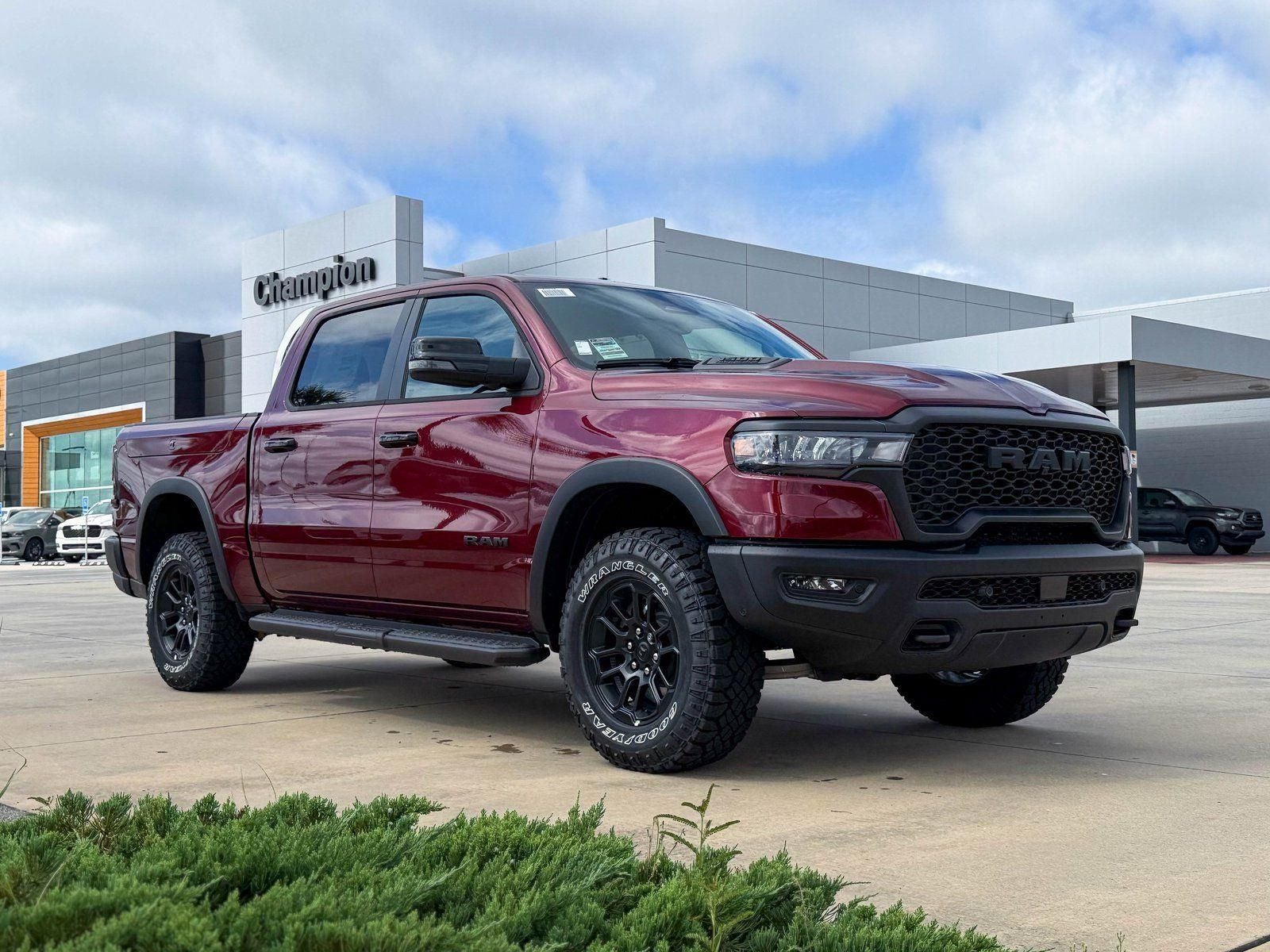 2026 RAM Ram 1500 RAM 1500 REBEL CREW CAB 4X4 5'7' BOX in Delmonico Red Pearl-Coat Exterior Paint — front three-quarter view