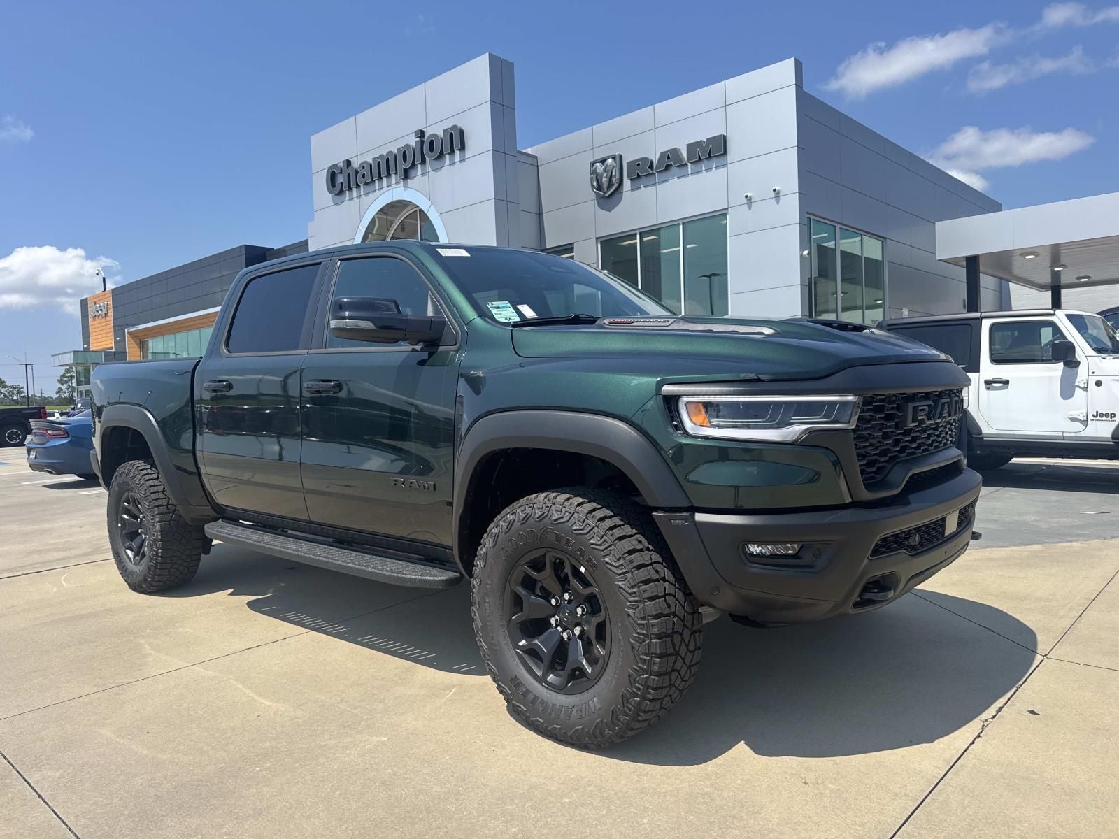 2026 RAM Ram 1500 RAM 1500 RHO CREW CAB 4X4 5'7' BOX in Serrano-Green Metallic Exterior Paint — front three-quarter view