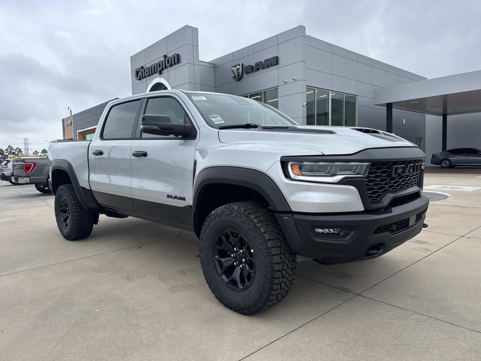 2026 RAM Ram 1500 RAM 1500 RHO CREW CAB 4X4 5'7' BOX in Silver Zynith Exterior Paint — front three-quarter view