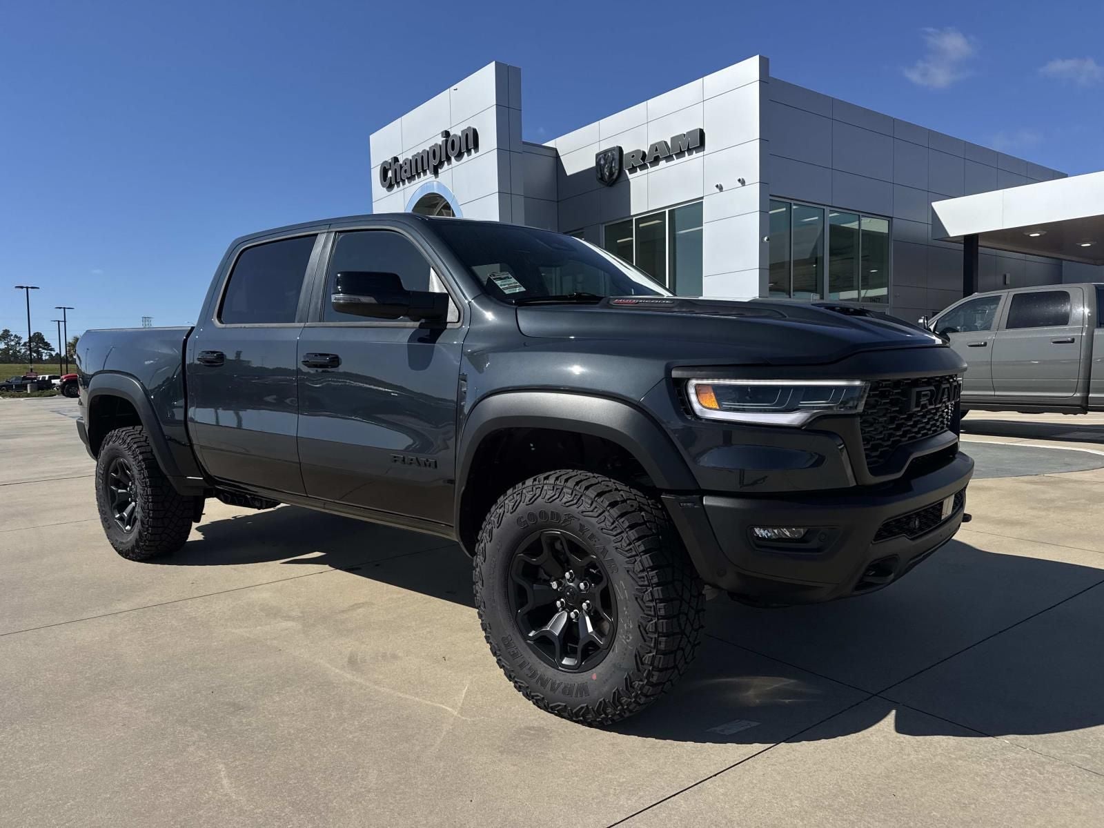 2026 RAM Ram 1500 RAM 1500 RHO CREW CAB 4X4 5'7' BOX in Forged Blue Metallic Exterior Paint — front three-quarter view