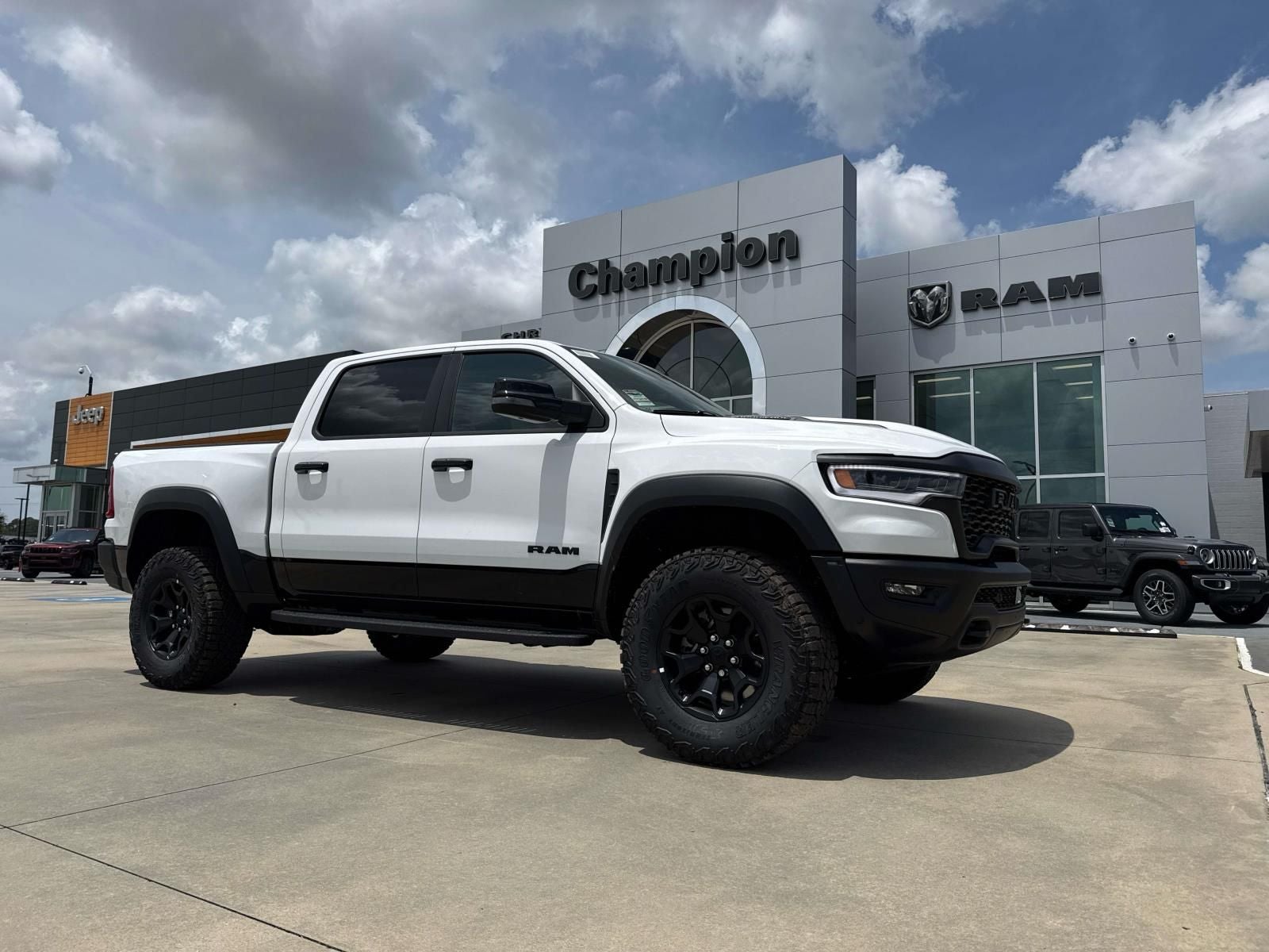 2026 RAM Ram 1500 RAM 1500 RHO CREW CAB 4X4 5'7' BOX in Bright White Clear-Coat Exterior Paint — front three-quarter view