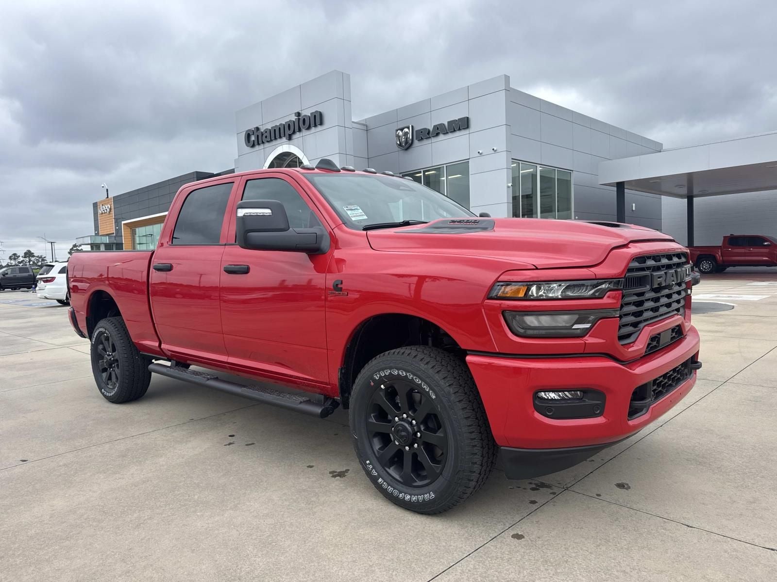 2026 RAM Ram 2500 RAM 2500 BLACK EXPRESS CREW CAB 4X4 6'4' BOX in Flame Red Clear-Coat Exterior Paint — front three-quarter view