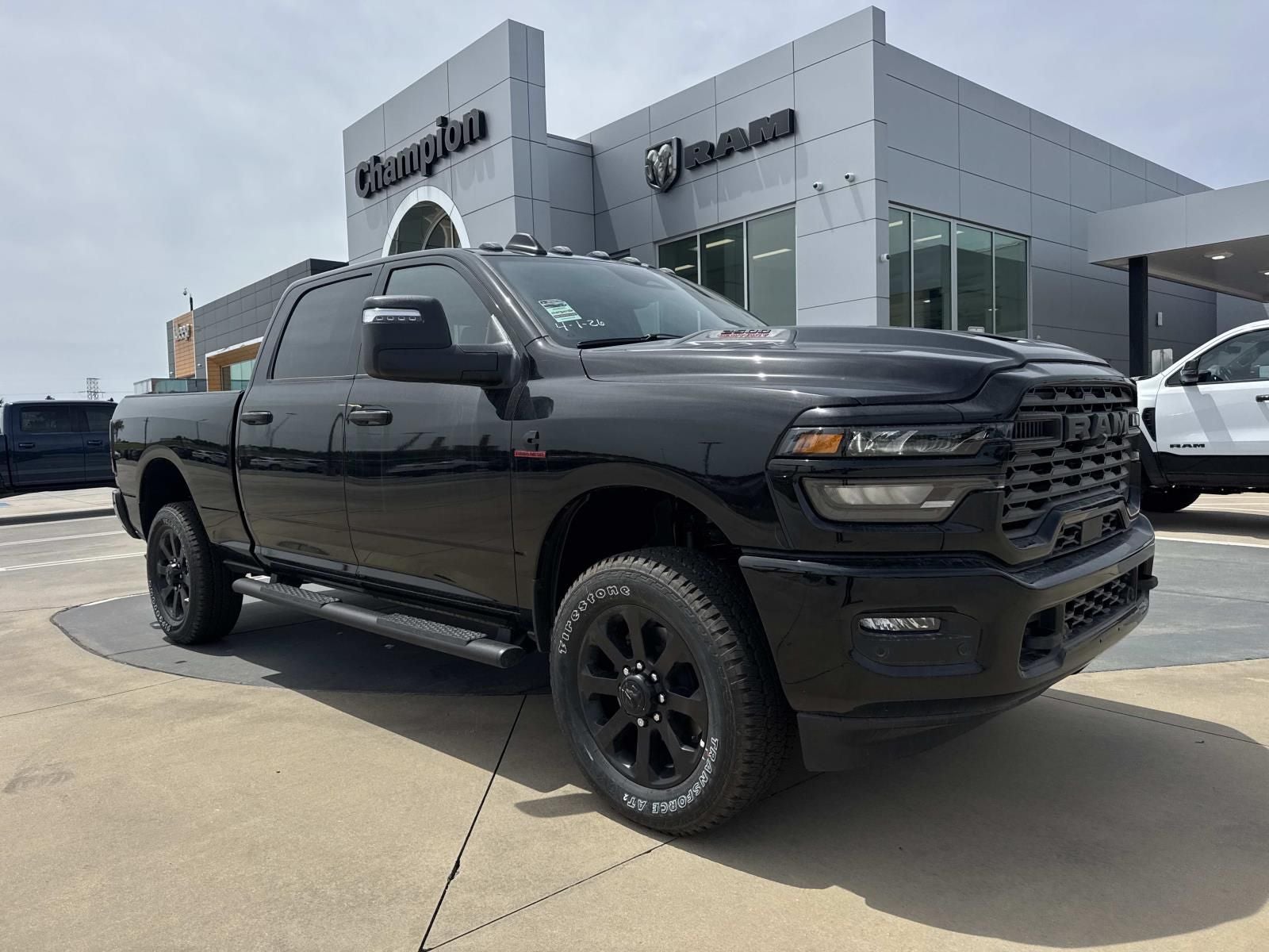 2026 RAM Ram 2500 RAM 2500 BLACK EXPRESS CREW CAB 4X4 6'4' BOX in Diamond Black Crystal Pearl-Coat Exterior Paint — front three-quarter view