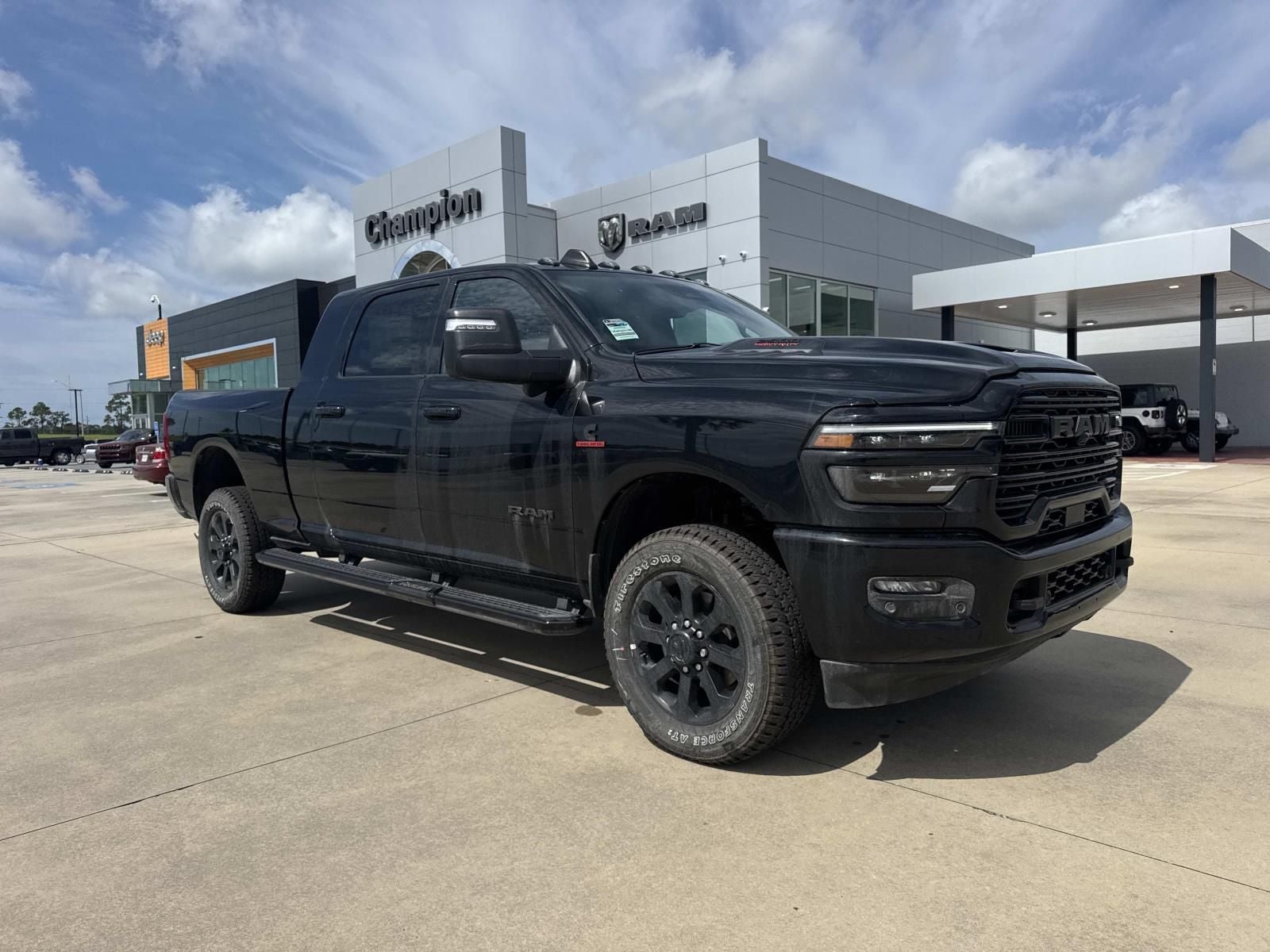 2026 RAM Ram 2500 RAM 2500 LARAMIE MEGA CAB 4X4 6'4' BOX in Diamond Black Crystal Pearl-Coat Exterior Paint — front three-quarter view