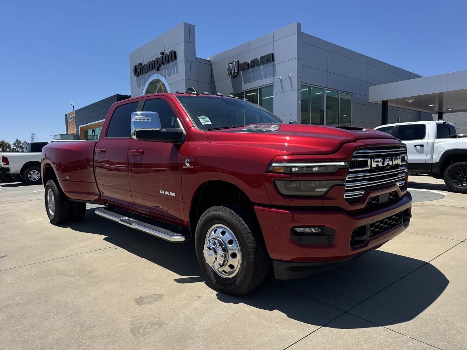 2026 RAM 3500 Laramie in Molten Red Pearlcoat — front three-quarter view