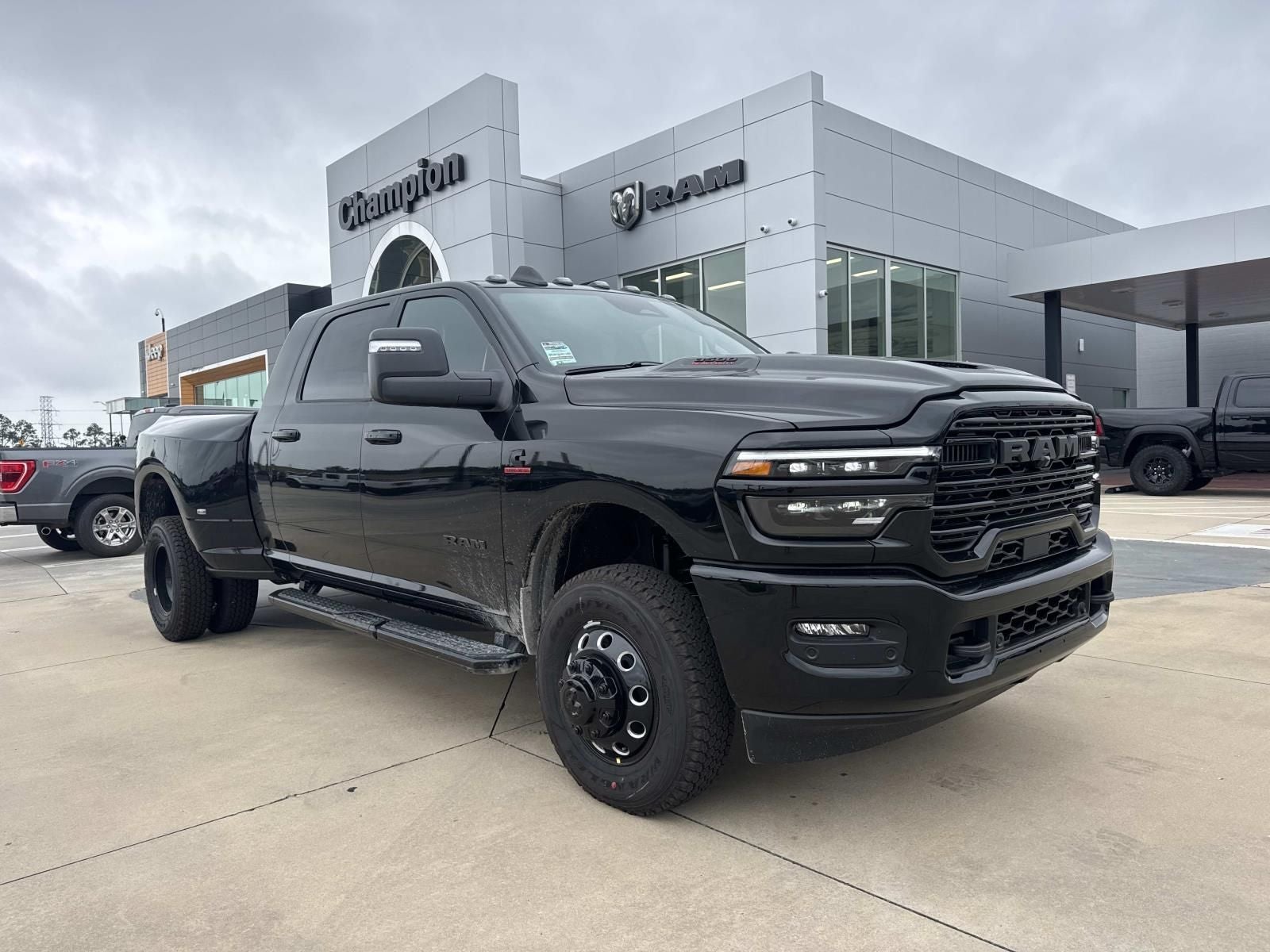 2026 RAM Ram 3500 RAM 3500 LARAMIE MEGA CAB 4X4 6'4' BOX in Diamond Black Crystal Pearl-Coat Exterior Paint — front three-quarter view
