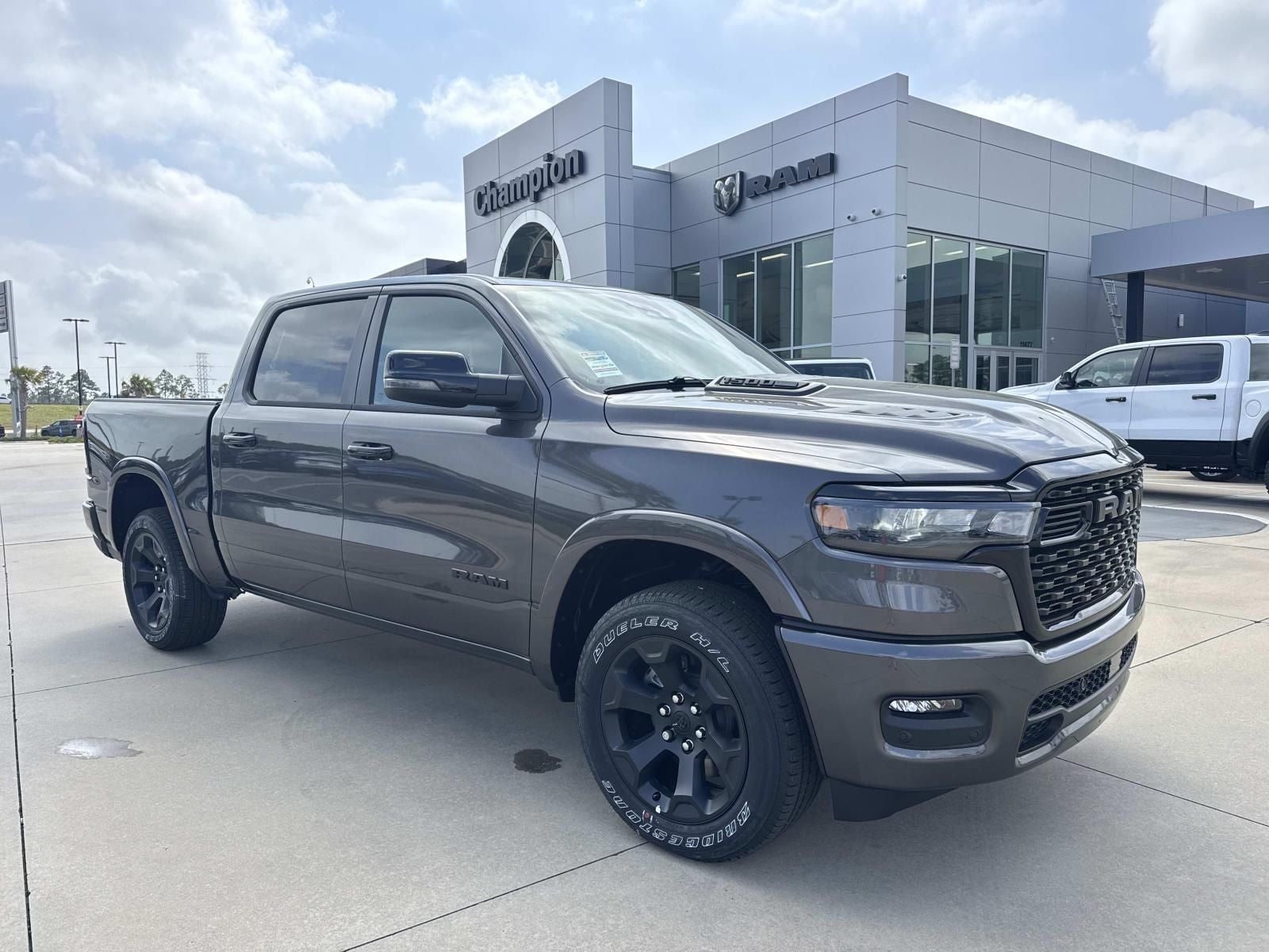 2026 RAM Ram 1500 RAM 1500 BIG HORN CREW CAB 4X4 5'7' BOX in Granite Crystal Metallic Clear-Coat Exterior Paint — front three-quarter view