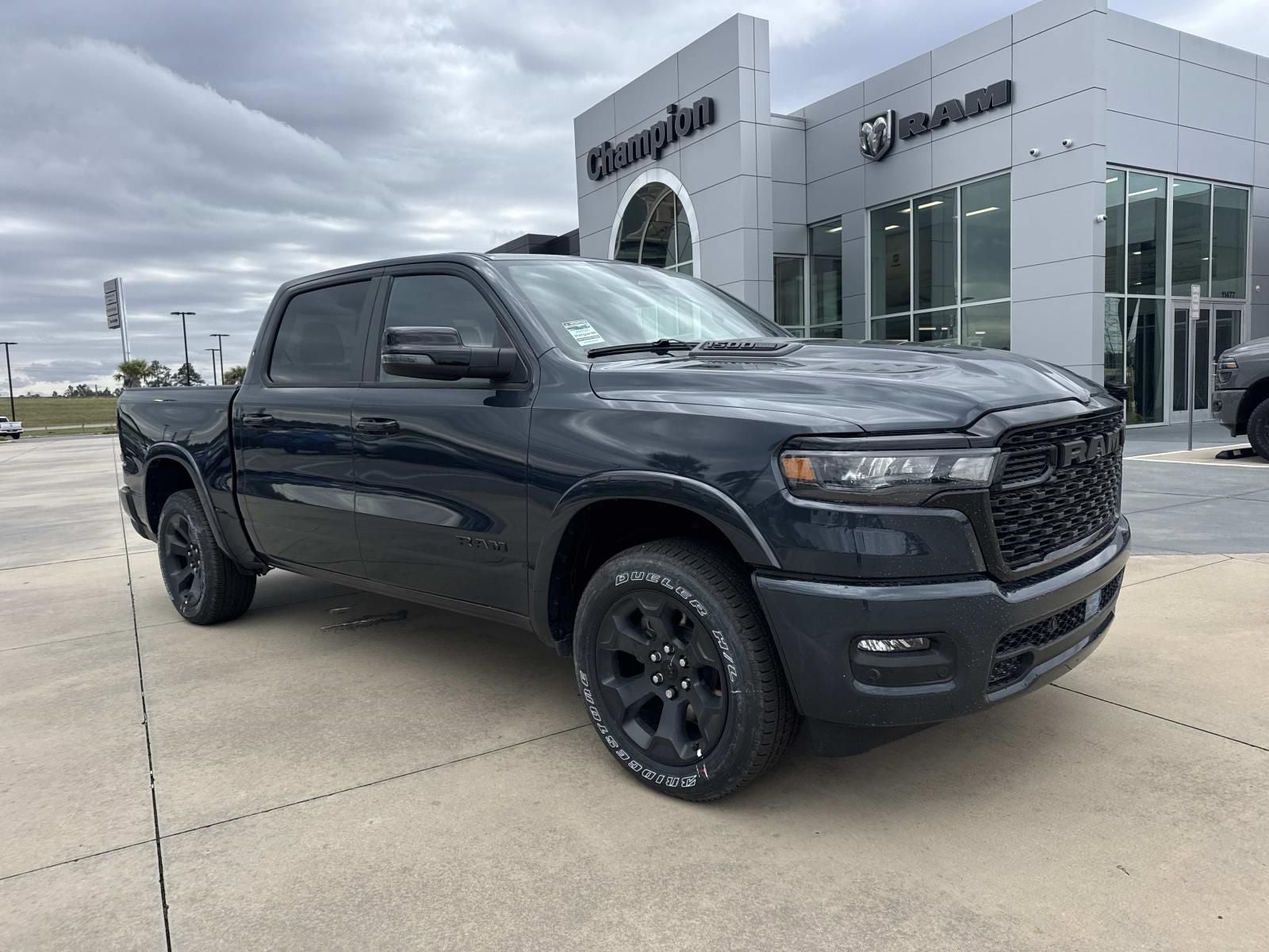 2026 RAM Ram 1500 RAM 1500 BIG HORN CREW CAB 4X4 5'7' BOX in Forged Blue Metallic Exterior Paint — front three-quarter view
