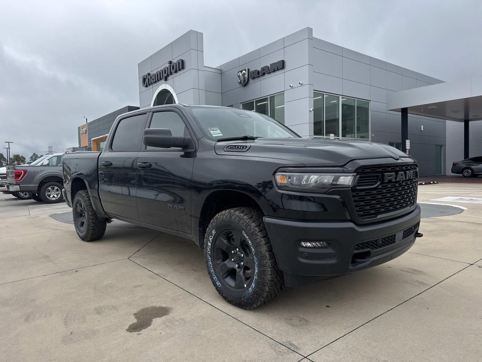 2026 RAM Ram 1500 RAM 1500 WARLOCK CREW CAB 4X4 5'7' BOX in Diamond Black Crystal Pearl-Coat Exterior Paint — front three-quarter view